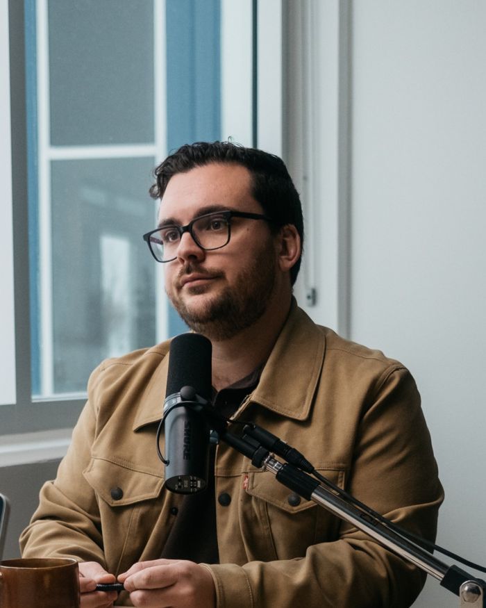 Andrew listening to a guest
